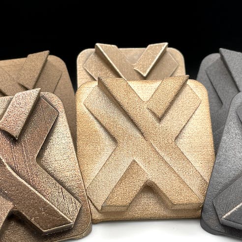 six metal printed Xometry "X's"